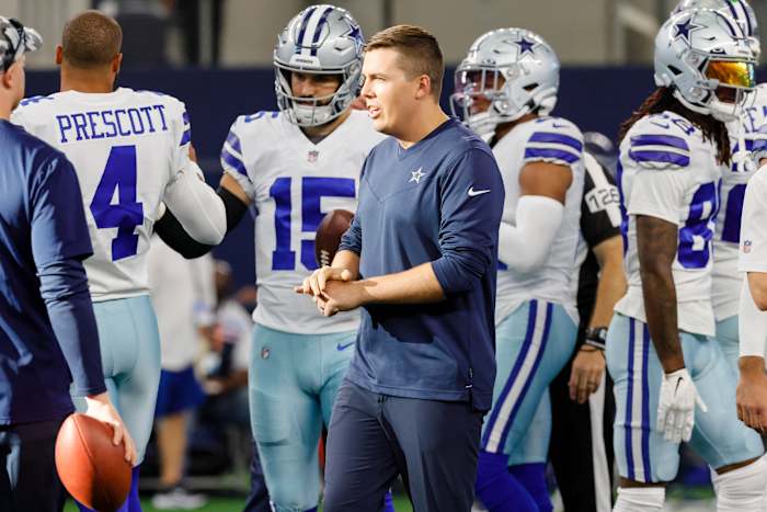 Kellen Moore walks the sideline before a preseason game